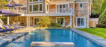 Modern, coastal-style home with flooding natural light, a private pool, a...