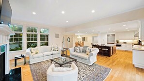 Relax in a spacious living area with a comfortable seating area and modern kitchen.