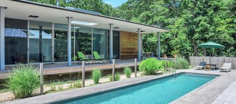 Modern home sited on a lush wood acre, stunning pool, covered deck, outdoor...