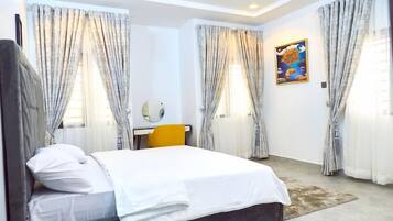 Deluxe Room, Balcony, City View | Desk, laptop workspace, blackout drapes, soundproofing