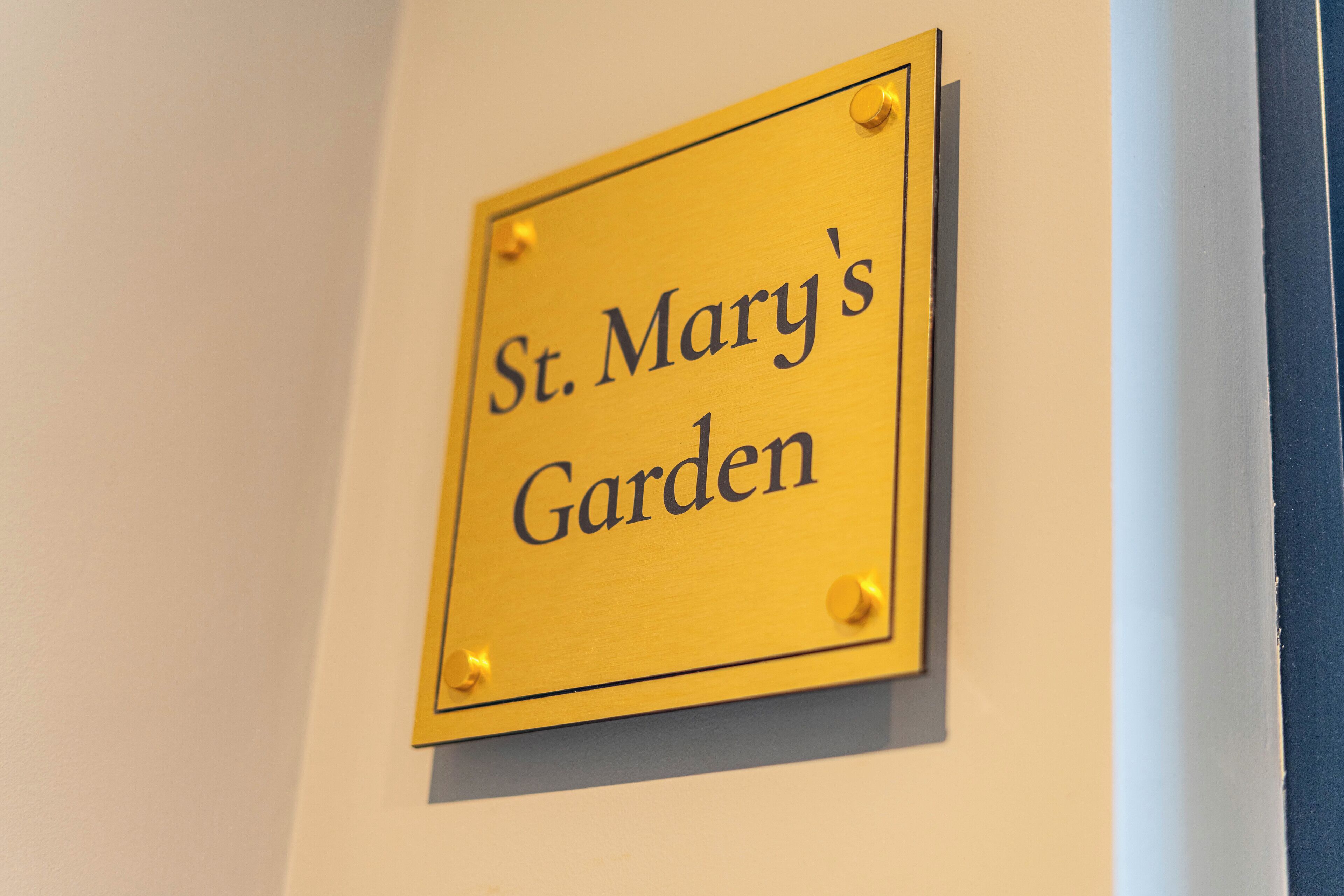 A sign that reads "St. Mary's Garden".