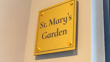 A sign that reads "St. Mary's Garden".