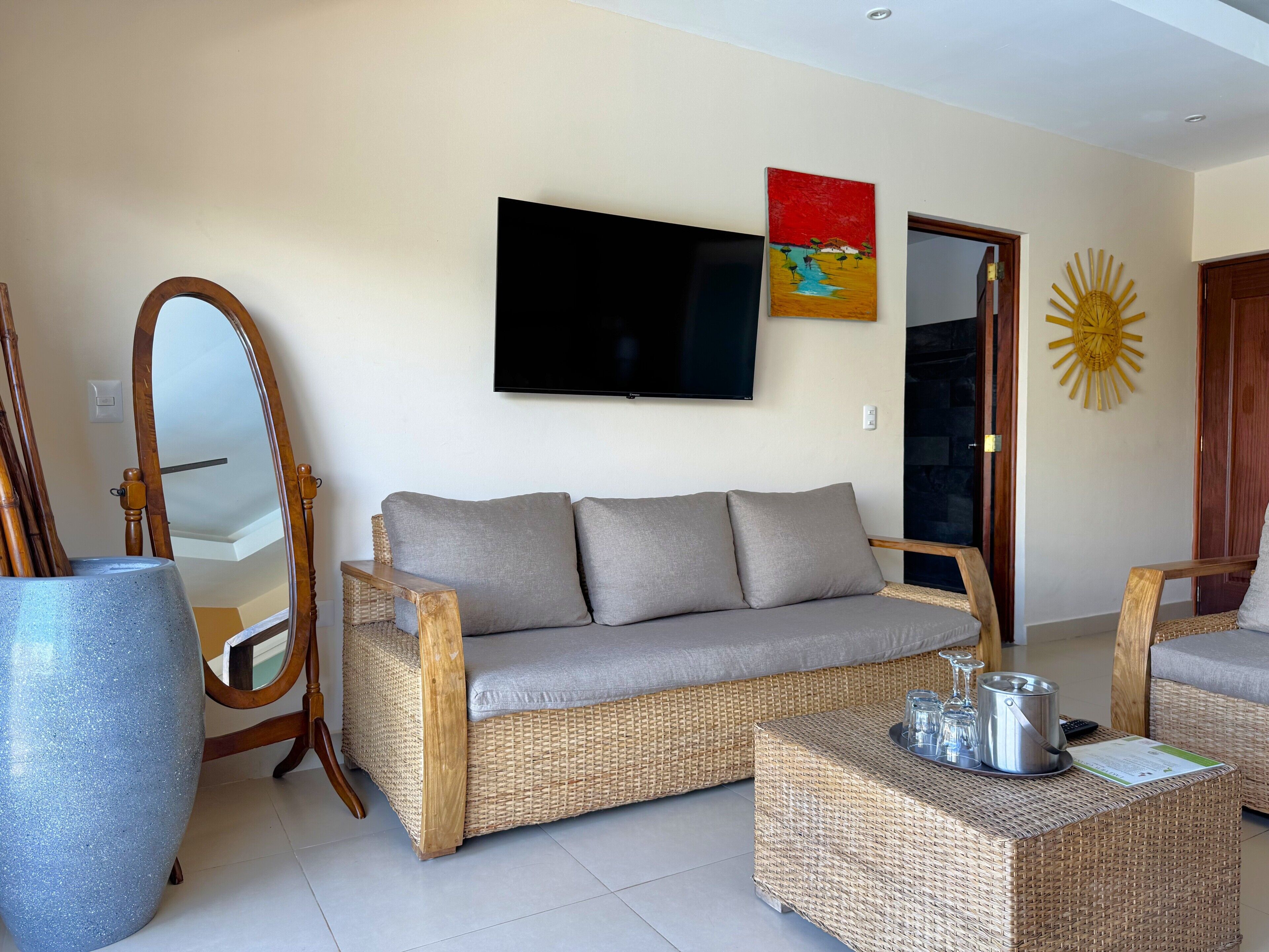 Junior Suite, Pool View | Living area | 50-inch plasma TV with digital channels