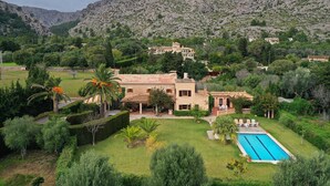 A Mediterranean-style villa with a swimming pool, surrounded by lush greenery and mountains. - H2935 Finca Solivelles in Pollenca for 8 persons (Pollenca)
