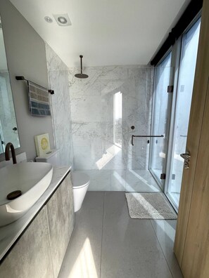 Shower, hair dryer, towels, soap
