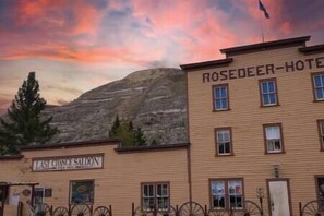 A building with a sign reading "ROSEDEER-HOTEL" and another sign below it reading "LAST CRASH SALOON". - #Y6 Wild West- 2 Double beds -Pet friendly, Wild West Yurt 2 Double Beds (Drumheller)