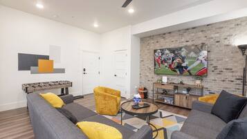 Smart TV, fireplace, foosball