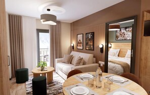 Une chambre d’hôtel moderne, dotée d’un canapé, d’une table à manger pour deux personnes et d’un lit avec une tête de lit en bois.
