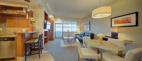 Deluxe Apartment, Balcony | Living area | 34-inch TV with cable channels