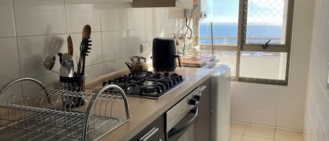 Fridge, microwave, stovetop, coffee/tea maker