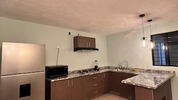 Fridge, microwave, stovetop, coffee/tea maker