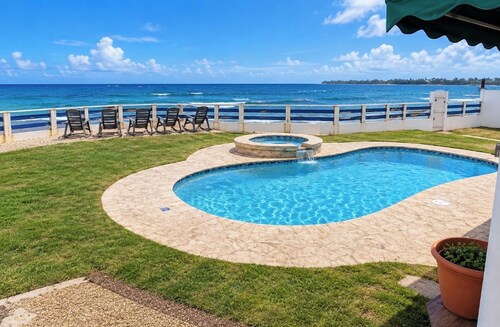 Breathtaking Beachfront Gem in Luquillo, WAVES  at Your Door.Centerally Located to Rainforest, BioBay, Ferry Trips, Airport, Horses, Golf, KIOSK. Your Charming Home is Fenced and Gated for Privacy, Right on the BEACH and a Blast of Family/Friend Fun.