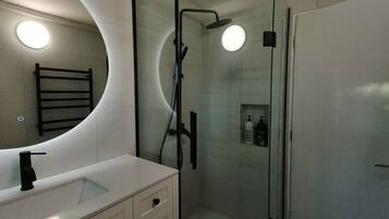 Shower, hair dryer, towels, soap