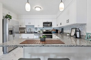 Fridge, microwave, oven, stovetop - 2BR Chic’s Beach Gem • Walk to Shore • Dogs OK (Virginia Beach)