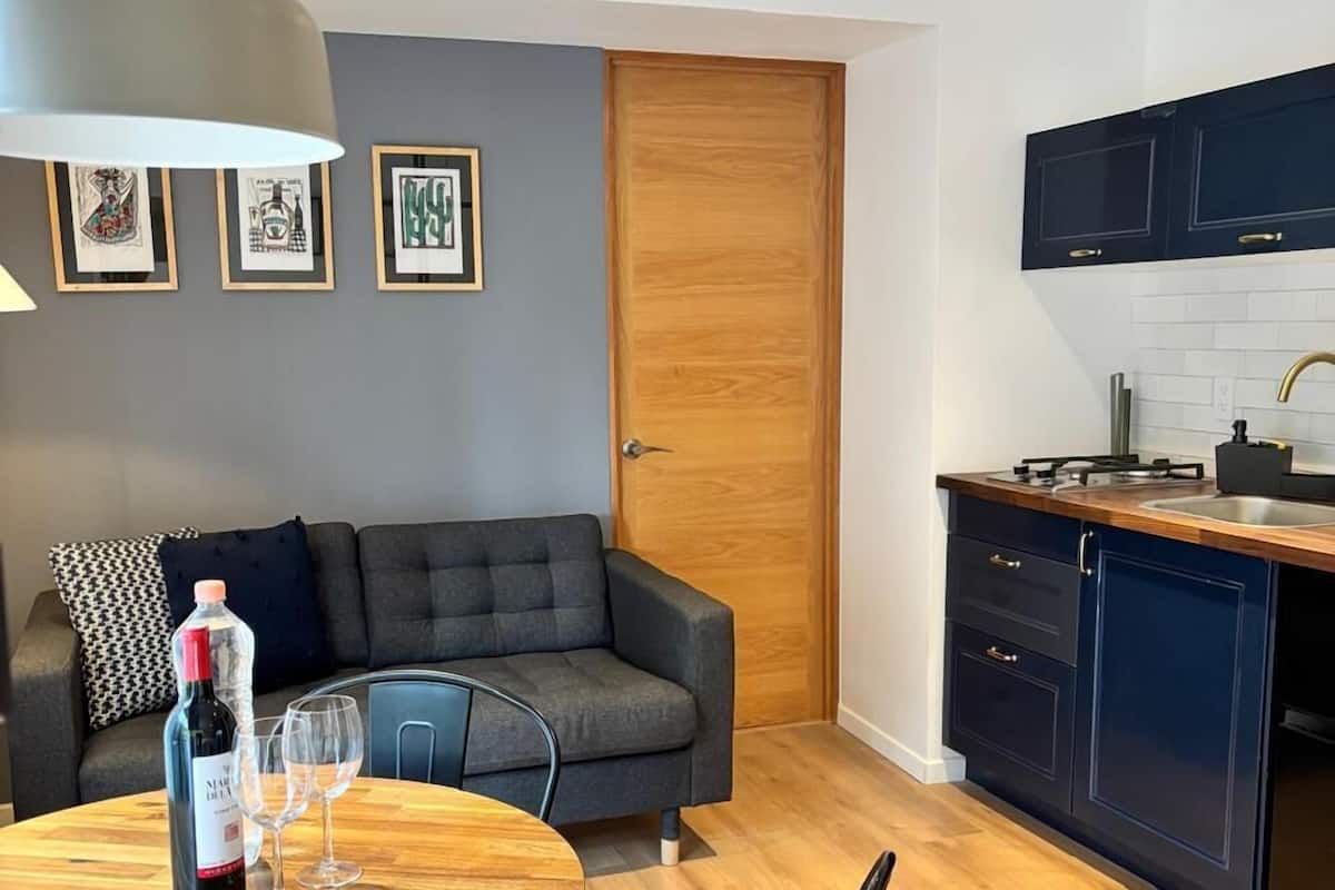 Deluxe Apartment, Balcony | Living area | Flat-screen TV