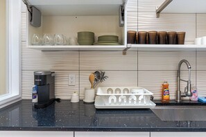 Where inspiration meets functionality   – our sunlit kitchen is a culinary haven: Brew, cook, and create with top-notch amenities at your fingertips. Your culinary journey starts here. - Spacious 3BR Oasis w/ Patio & Arcade Fun in Philly (Philadelphia)