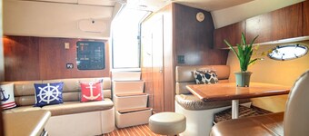 Very luxurious accommodation on a boat, room, bathroom and fine wood finishes.
