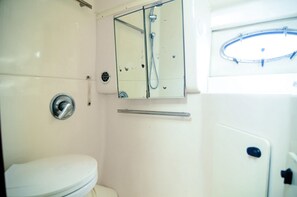 Shower, hair dryer, towels, soap - Very luxurious accommodation on a boat, room, bathroom and fine wood finishes. (La Romana)