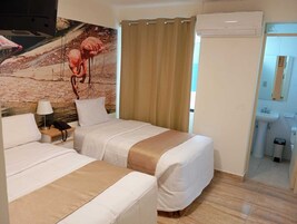 Chambre Triple Classique | Draps italiens Frette, literie de qualité supérieure