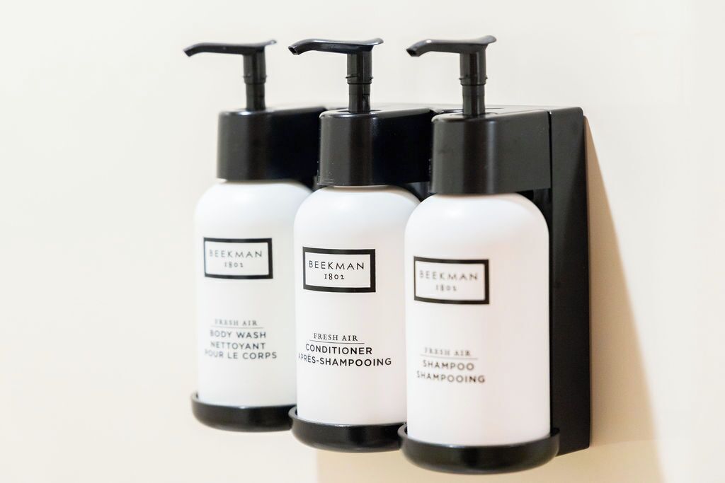 Three bottles of Beekman 1802 fresh air conditioner shampooing, body wash, and conditioner.