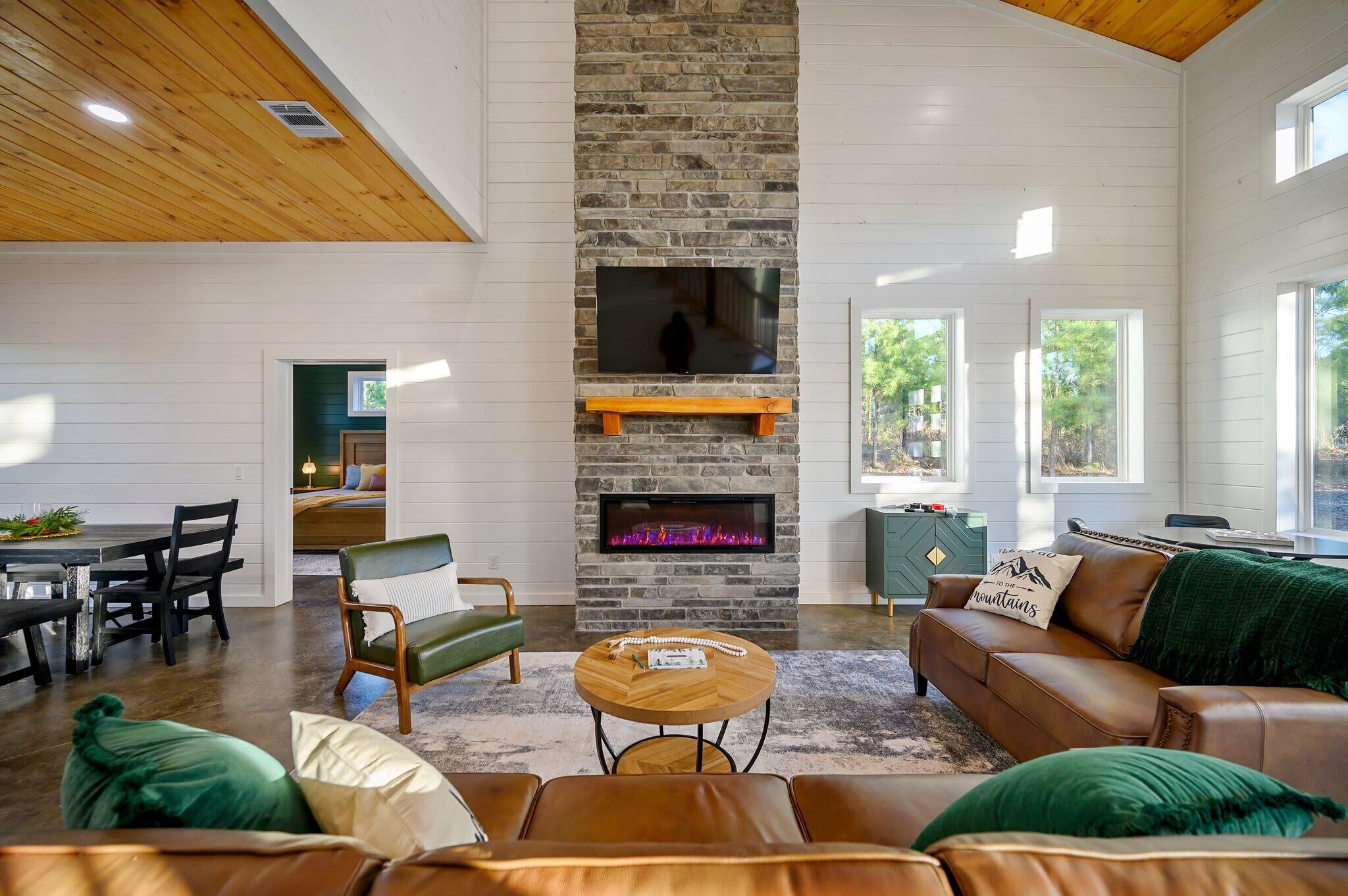 Cabin, Multiple Beds, Hot Tub, Garden View (Hidden Pearl) | Living area | 50-inch flat-screen TV with digital channels, fireplace