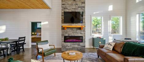 Cabin, Multiple Beds, Hot Tub, Garden View (Hidden Pearl) | Living area | 50-inch flat-screen TV with digital channels, fireplace