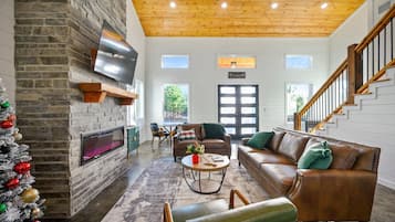 Cabin, Multiple Beds, Hot Tub, Garden View (Hidden Pearl) | Living area | 50-inch flat-screen TV with digital channels, fireplace