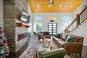 Cabin, Multiple Beds, Hot Tub, Garden View (Hidden Pearl) | Living area | 50-inch flat-screen TV with digital channels, fireplace