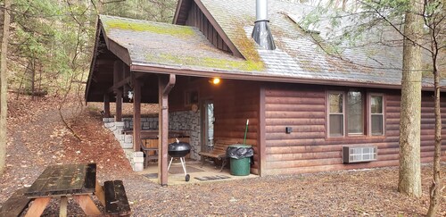 Adventurer's  Lodge, a charming 3-bedroom cabin with WiFi in quiet Lansing, WV.