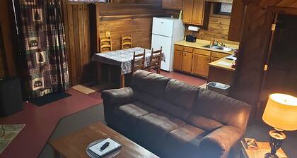 Adventurer's Lodge, a charming 3-bedroom cabin with WiFi in quiet Lansing, WV.