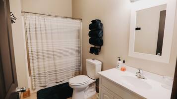 Hair dryer, towels, soap, toilet paper