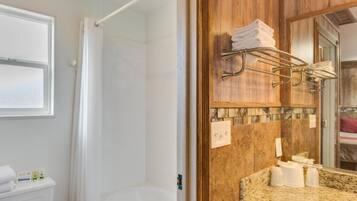 Bathtub, hair dryer, towels, soap