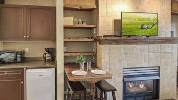 Fridge, microwave, coffee/tea maker, cookware/dishes/utensils