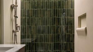 A bathroom with a shower, a toilet, and a sink. - Constance Luxury Apartment by DomuSicily (Palermo)