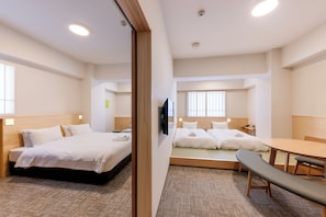 Family Quadruple Room | 1 bedroom, in-room safe, blackout drapes, iron/ironing board
