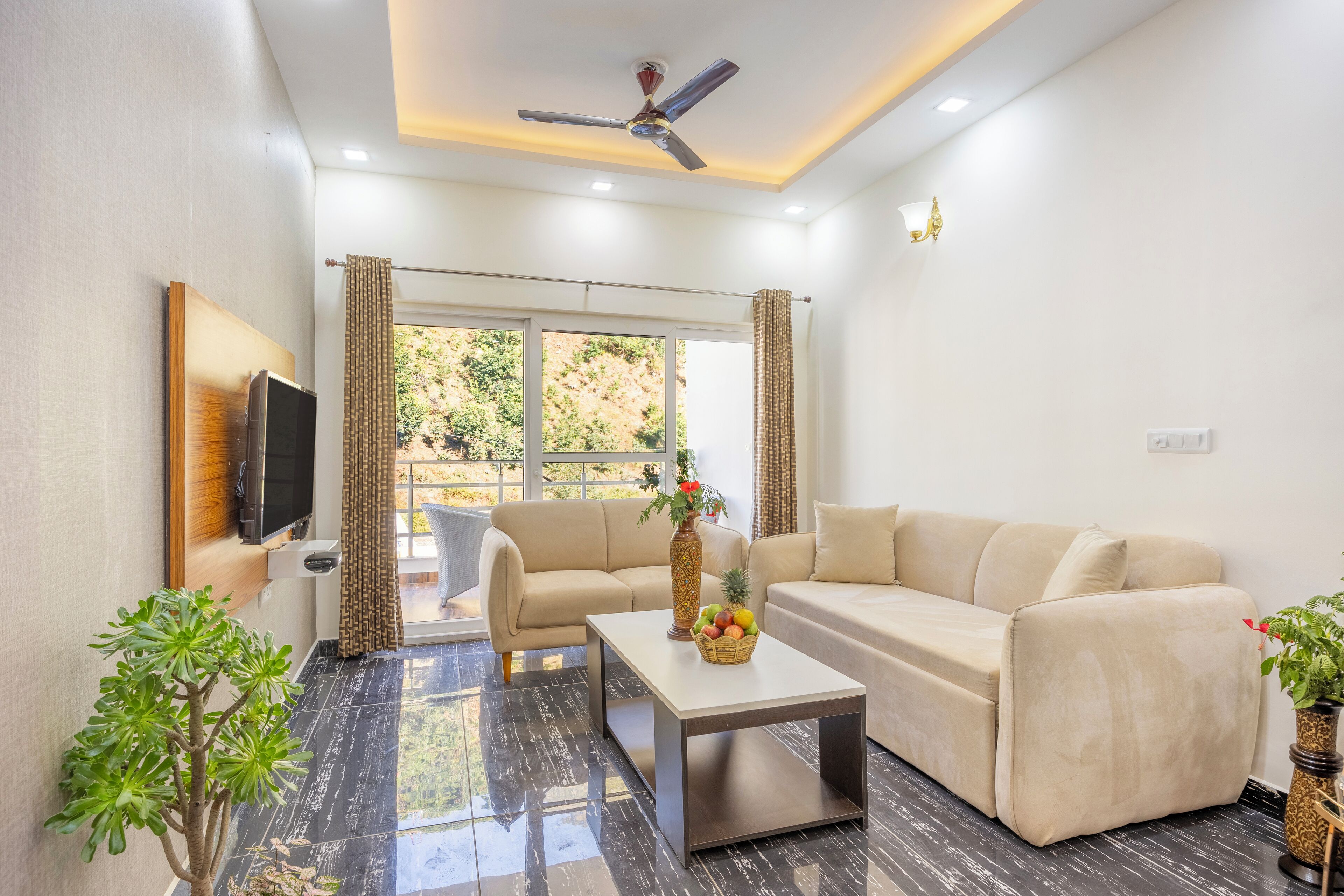 Kingdom Heartz 1bhk | Living area | 32-inch Smart TV with satellite channels