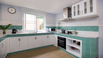 Family Villa, 3 Bedrooms, Patio, Garden View | Private kitchen | Electric kettle, toaster