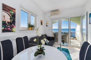 Enjoy the ocean view from the large windows and relax on the balcony through the sliding glass door.