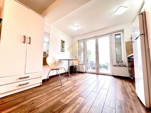 Studio (Studio Apartment) | Private kitchen | Fridge