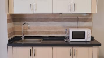 Standard Suite, Balcony, City View | Private kitchen | Mini-fridge, microwave, coffee/tea maker, cookware/dishes/utensils