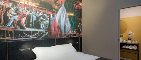 A hotel room with a bed, a nightstand, a wall-mounted shelf with toiletries, and a large mural depicting a historical scene.