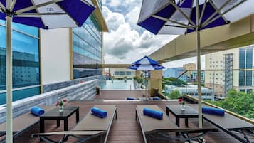 Outdoor pool, open 7:00 AM to 7:00 PM, pool umbrellas, sun loungers