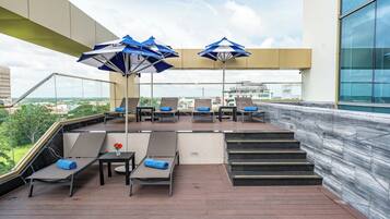 Outdoor pool, open 7:00 AM to 7:00 PM, pool umbrellas, sun loungers