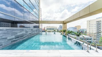 Outdoor pool, open 7:00 AM to 7:00 PM, pool umbrellas, sun loungers