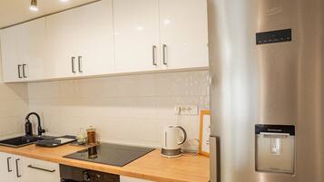 Dishwasher, coffee/tea maker, cookware/dishes/utensils