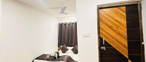 Premium bedding, memory-foam beds, desk, laptop workspace