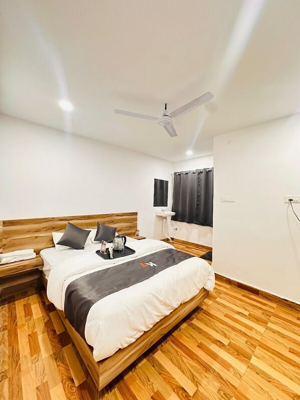 Premium bedding, memory-foam beds, desk, laptop workspace