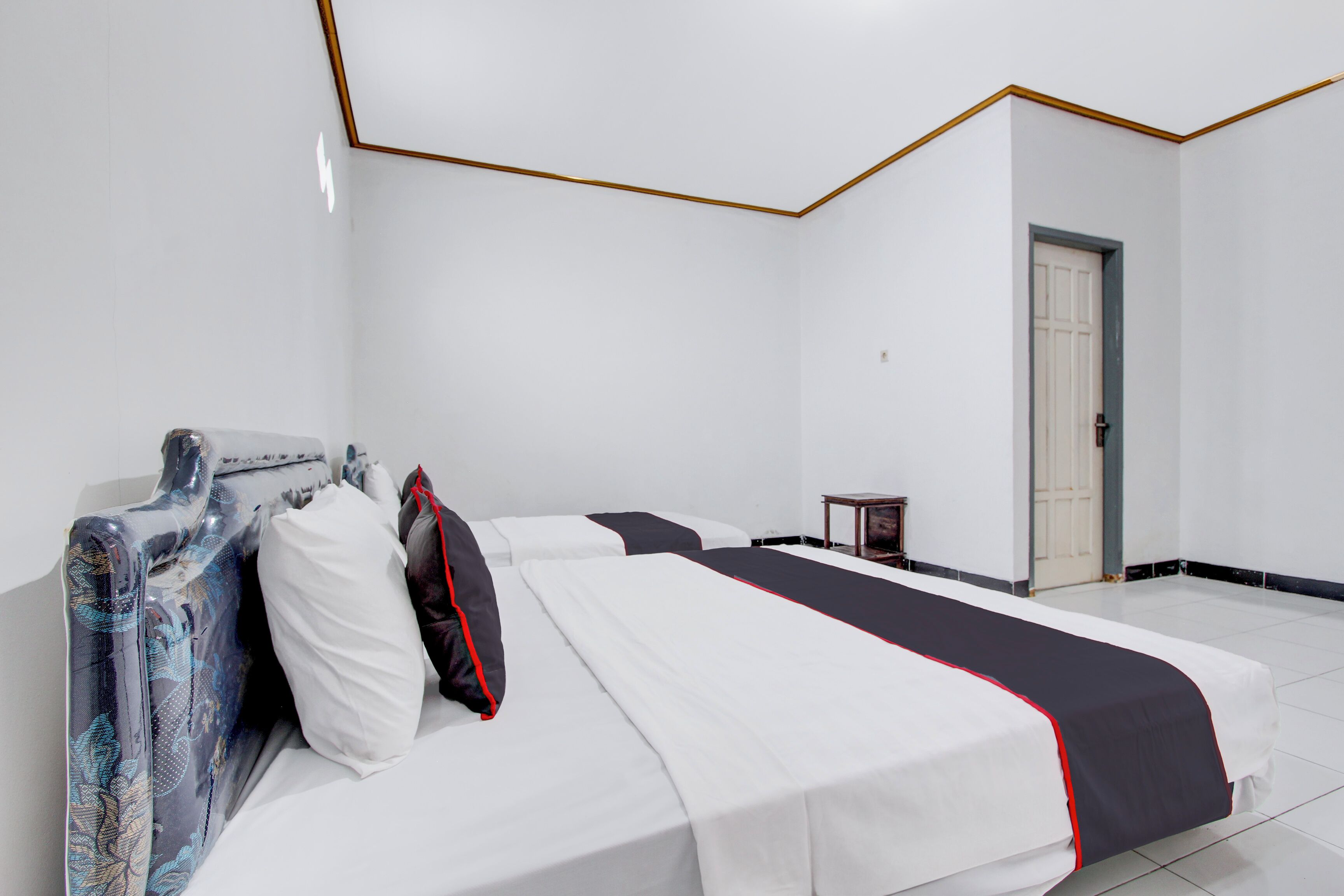 Laptop workspace, bed sheets