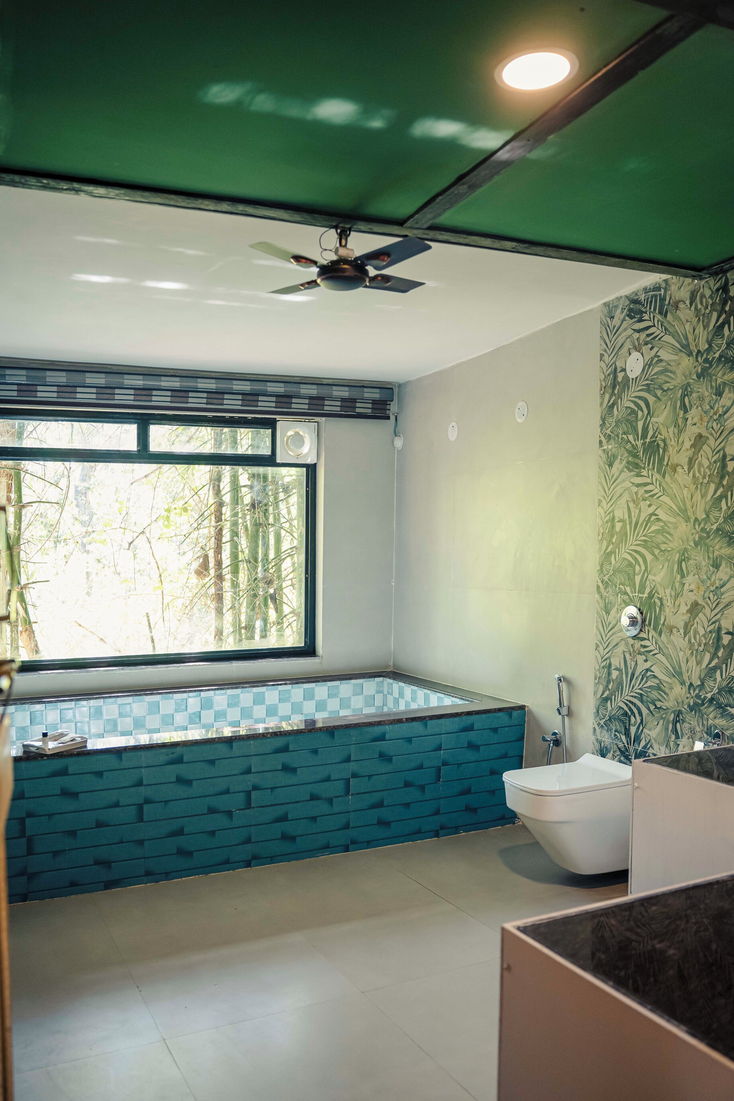 A bathroom with a bathtub, a toilet, and a sink.