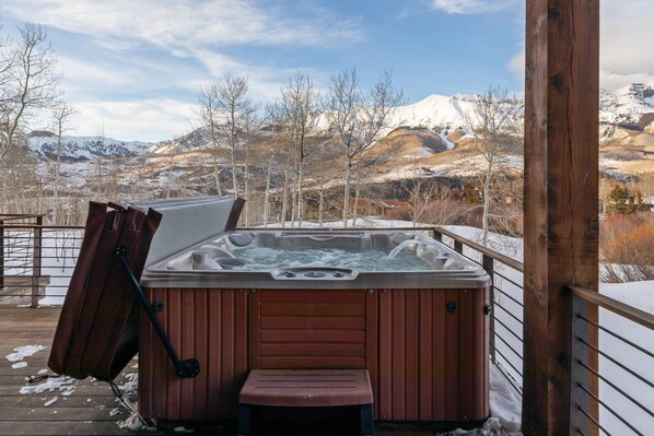A hot tub on a wooden deck with a view of snow-covered mountains. - New! Stunning Mountain Views, Private Hot Tub, Perfect Layout (Mountain Village)